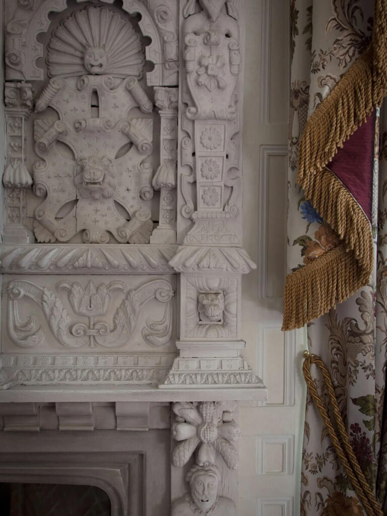 Carved stone fireplace at Cliveden House in England, captured by a Boston interior designer.