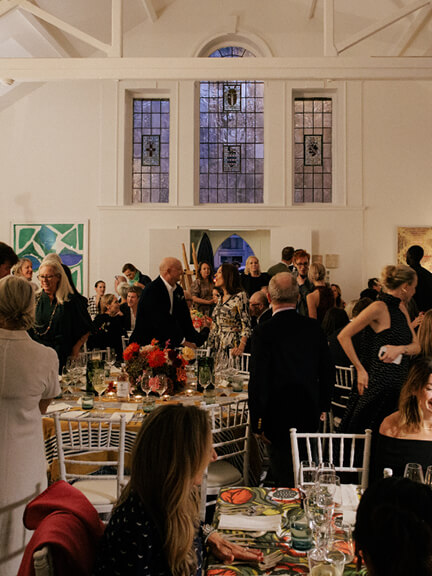 Full room view of a luxury fabric house anniversary party in London.