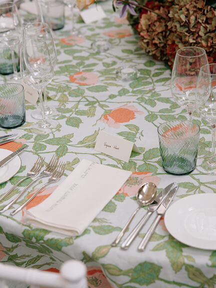 Printed linen fabric in the Richmond pattern in aqua used as a custom tablecloth.