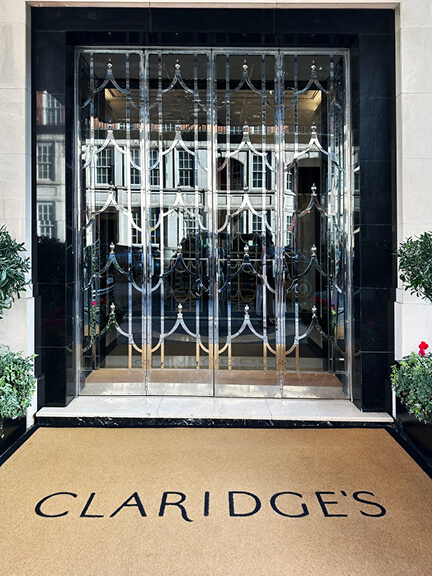 Art Deco doors at Claridge’s in London with luxurious hotel design and classic architectural detailing.