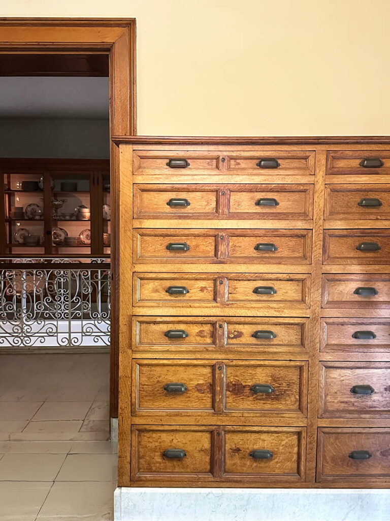 Custom millwork and storage cabinetry in a New England historic home at The Elms, showcasing early craftsmanship and timeless materials.