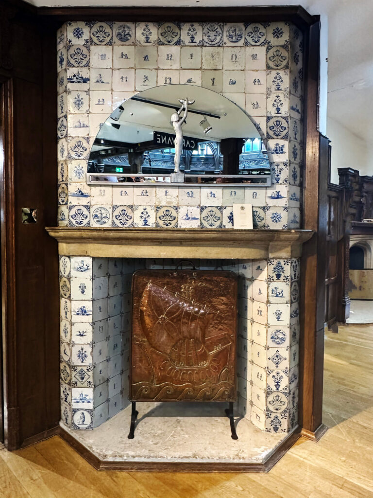 Liberty London department store Delft tile fireplace showcasing classic blue and white ceramic patterns.