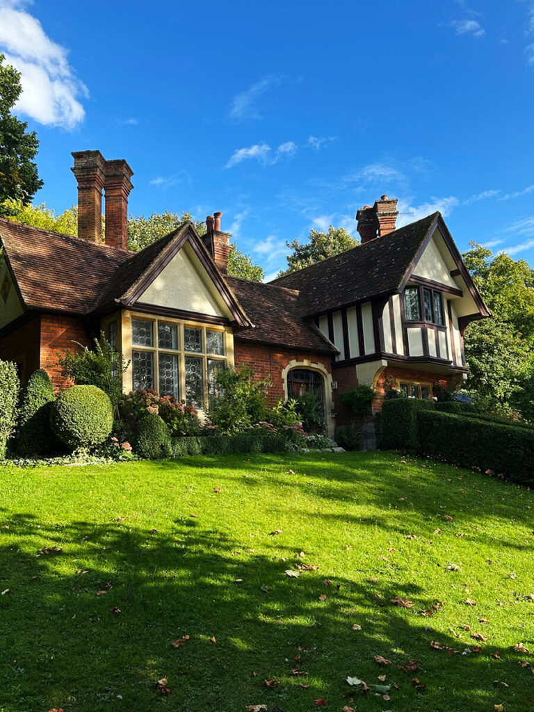 Historic English Estate Design shown in an exposed timber-frame cottage with brick infill and classic leaded windows in Buckinghamshire.