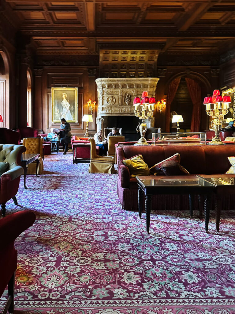 Great hall at Cliveden House featuring a Persian rug that complements English manor interior design.