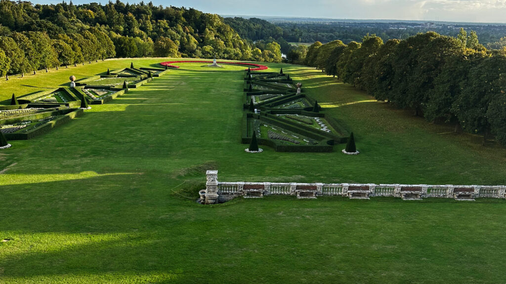 Historic English Estate Design captured in the formal parterre garden at Cliveden House, with patterned hedges and stone balustrades.