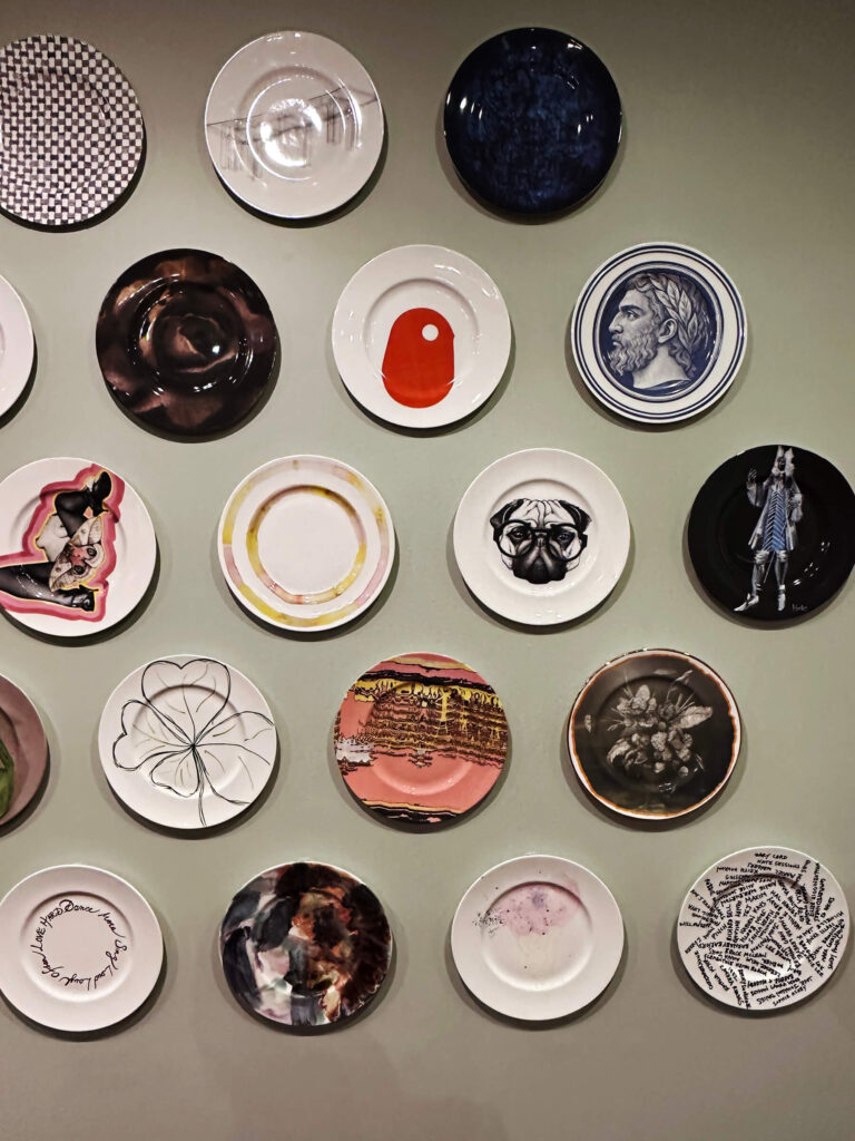 Fortnum & Mason London shopping display with ceramic plates and classic British tableware.