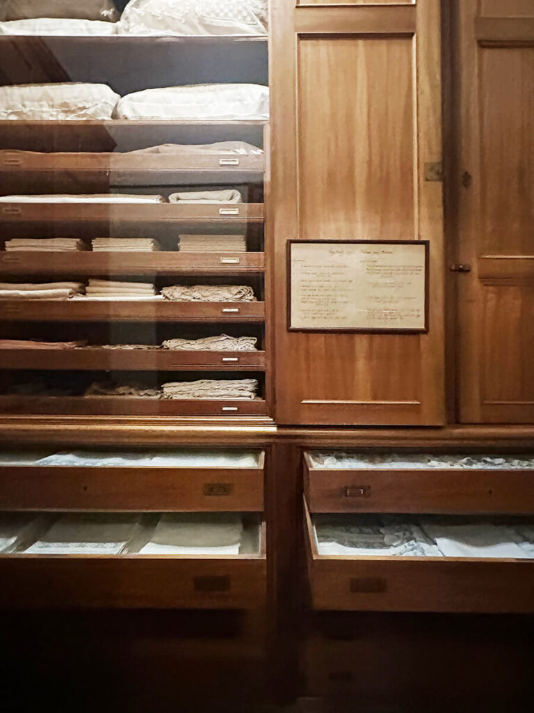 Greek fret tile flooring and natural wood drawers in a New England historic home kitchen at The Elms in Newport.