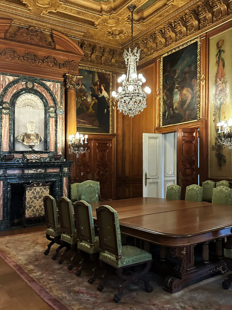 Historic dining room at The Elms in Newport with carved millwork, antique furnishings, and refined detailing admired by New England designers.
