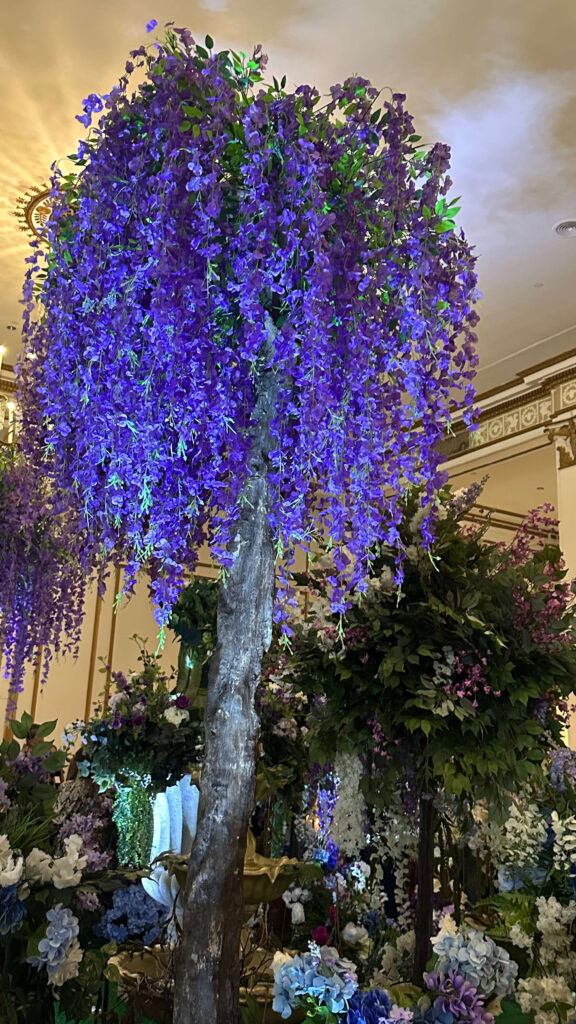 Purple floral arrangements and event decor displayed during the cocktail hour at the IFDA New England Interior Design Awards 2025 in Boston