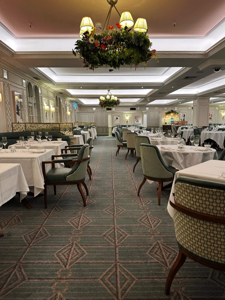 Interior design at Fortnum & Mason London restaurant, blending historic architecture and soft teal tones for Eat Sleep Shop London.