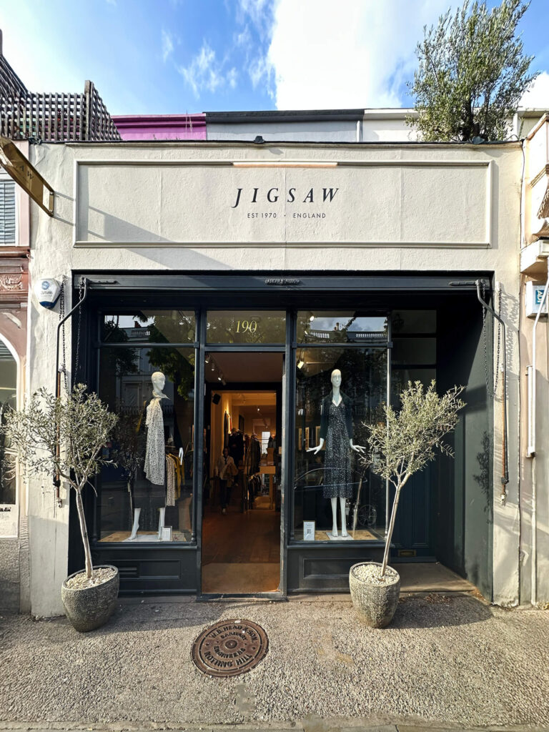 Jigsaw’s Notting Hill boutique blends heritage British design with modern classics in a refined retail setting.