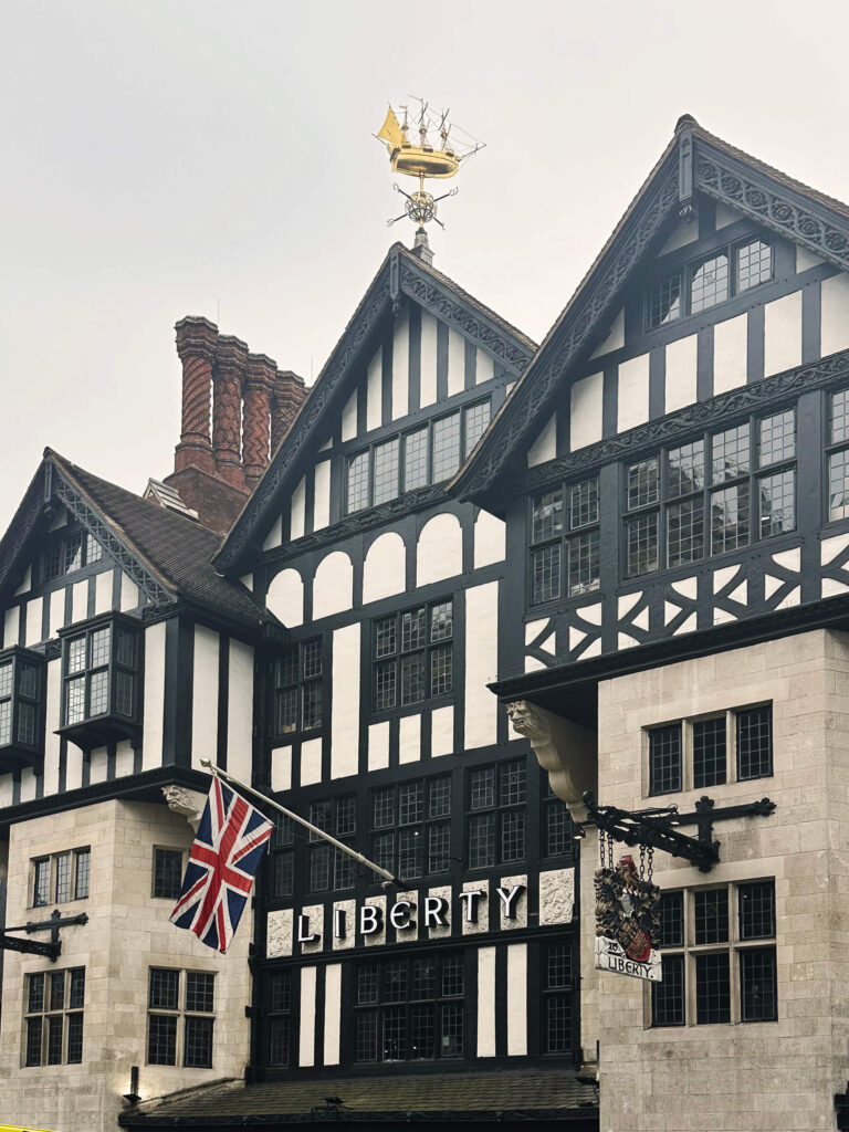 Boston interior designer visits London’s Liberty exterior, showing timber beams and the store’s striking multi-level atrium.
