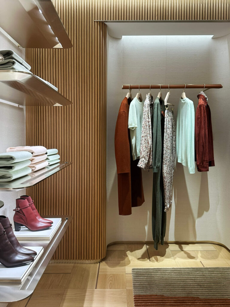 Loro Piana boutique interior at Harrods London, showcasing warm materials and Italian luxury for Eat Sleep Shop London.
