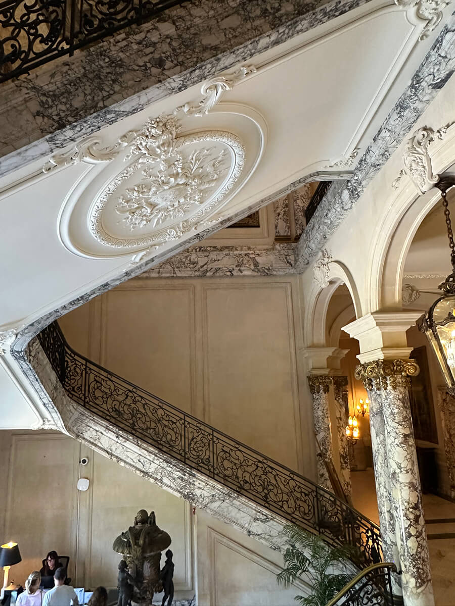 Marble staircase and columns at The Elms in Newport, Rhode Island, showcasing classic detailing and historic home craftsmanship.