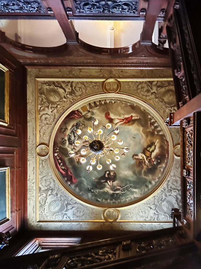 Painted ceiling by Auguste Hervieu at Cliveden House depicting the Sutherland children as the four seasons in English manor interior design.