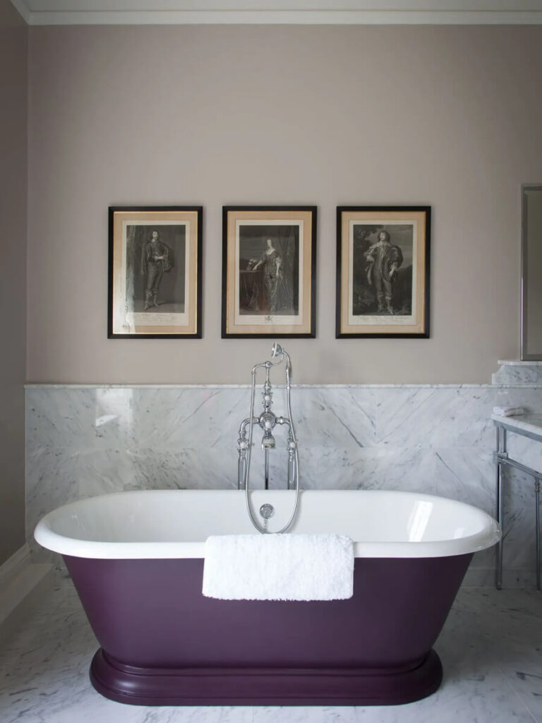 Purple bathtub in a traditional English bathroom styled by a Boston interior decorator blending old and new design.