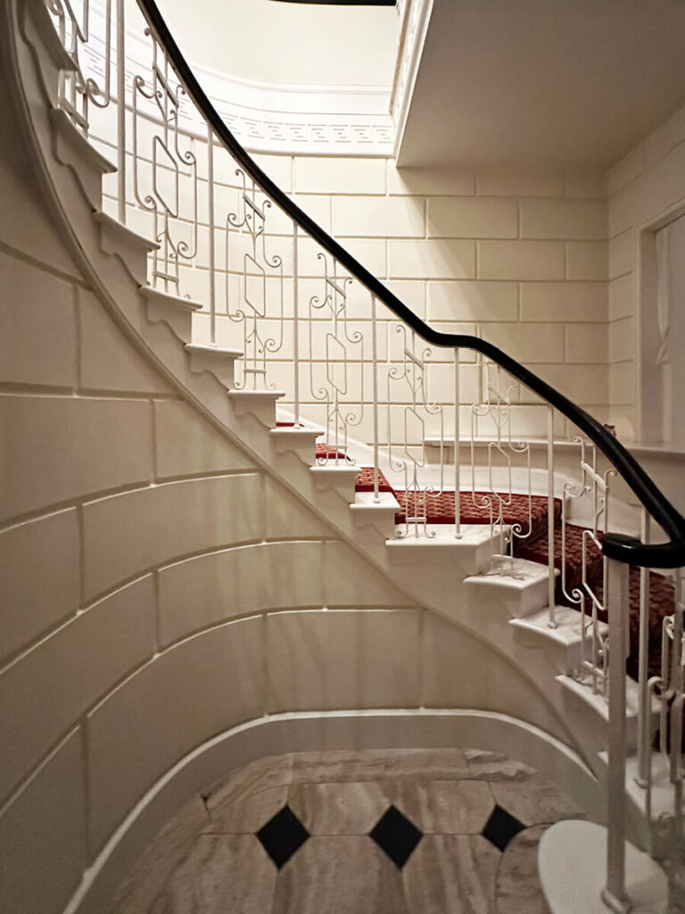 Eat sleep shop London highlights the stone staircase at The Twenty Two club in London, showcasing classic interior architecture and refined hospitality design.