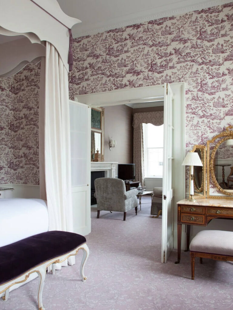 Toile wallpaper at Cliveden House, a five-star hotel showcasing refined English manor interior design.
