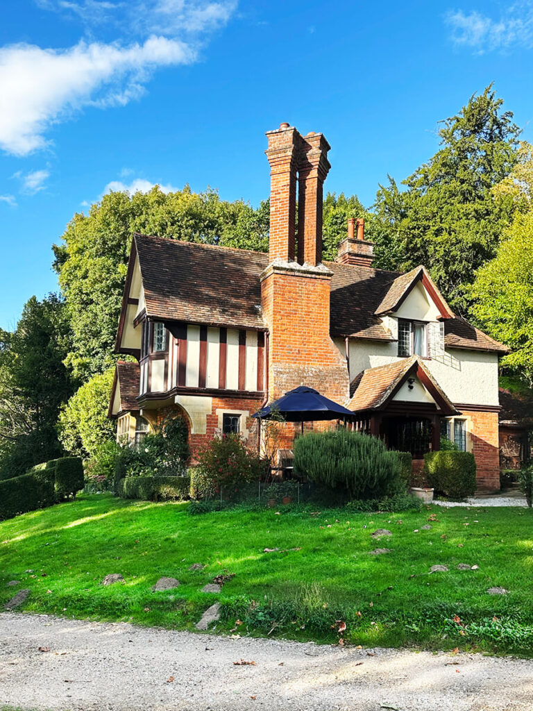 Traditional English cottage architecture in Buckinghamshire with brick walls, timber framing, and leaded glass windows.