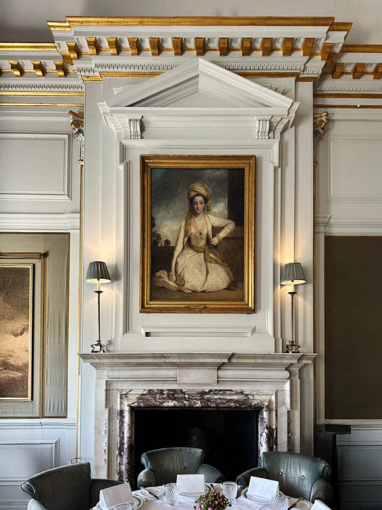 White and gold millwork in the dining room at Cliveden House, showcasing classic proportions in historic home design.