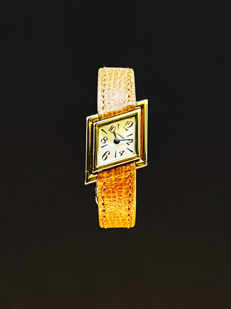 A 1970s Cartier watch with a clean dial and bold case shape featured in the Cartier Jewelry Exhibit.