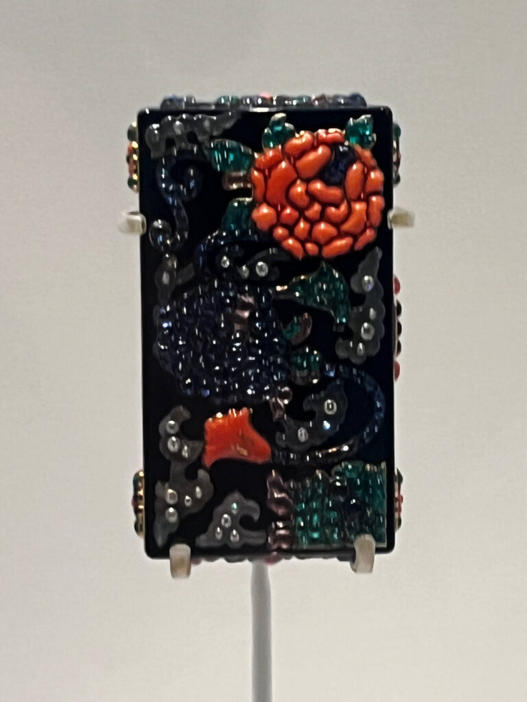 A 1927 Cartier Chinese-inspired vanity case with enamel, lacquer, and intricate geometric detailing.