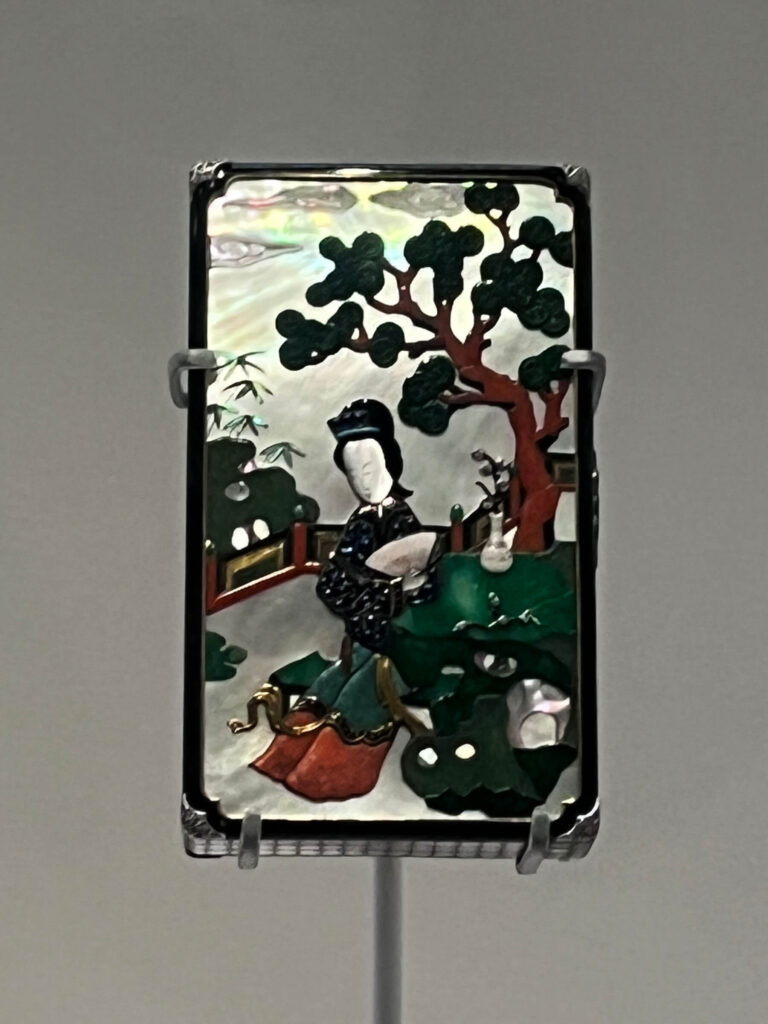 A Chinese-inspired Cartier vanity case with rich enamel and lacquer detailing shown in the Cartier Jewelry Exhibit.