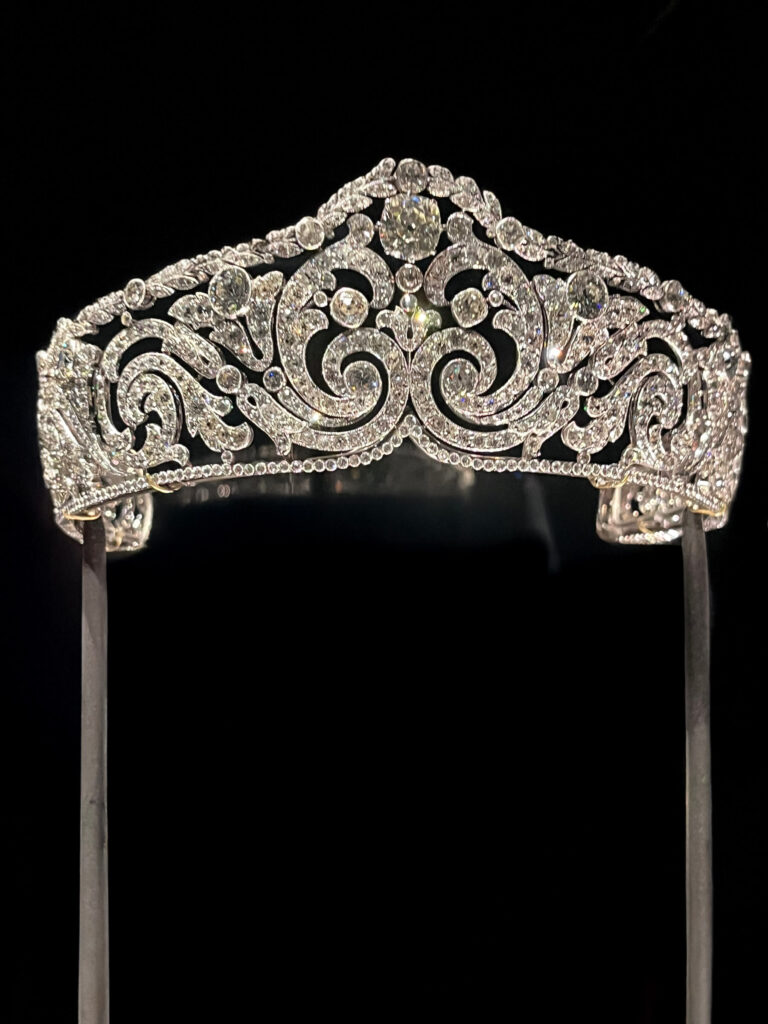 A closeup view of a Cartier diamond tiara with refined platinum detailing.