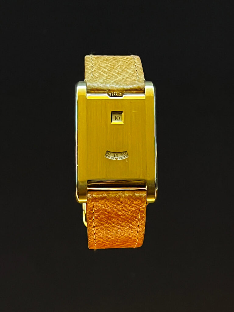 A classic Cartier leather-strap watch with a refined case and clean dial displayed in the Cartier Jewelry Exhibit.