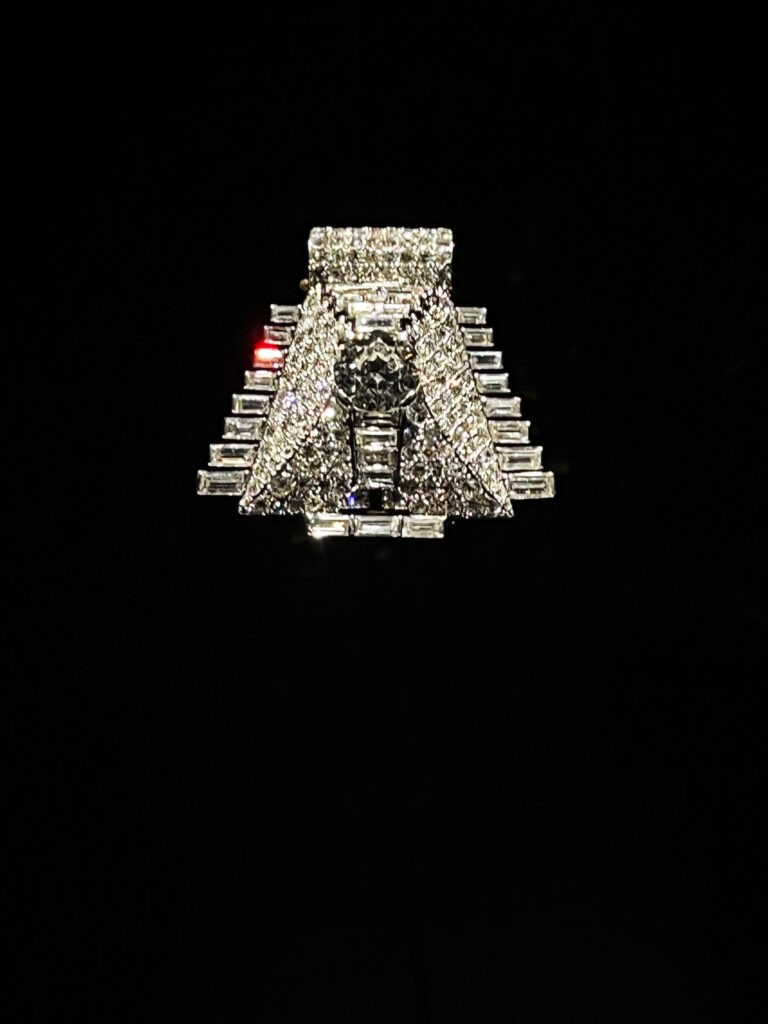 A geometric Cartier pyramid brooch from 1935 with diamonds set in platinum.