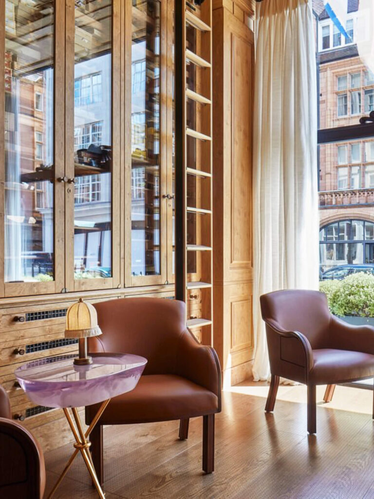 London hotel design The Connaught where to eat and drink in Mayfair with leather chairs and traditional architecture.