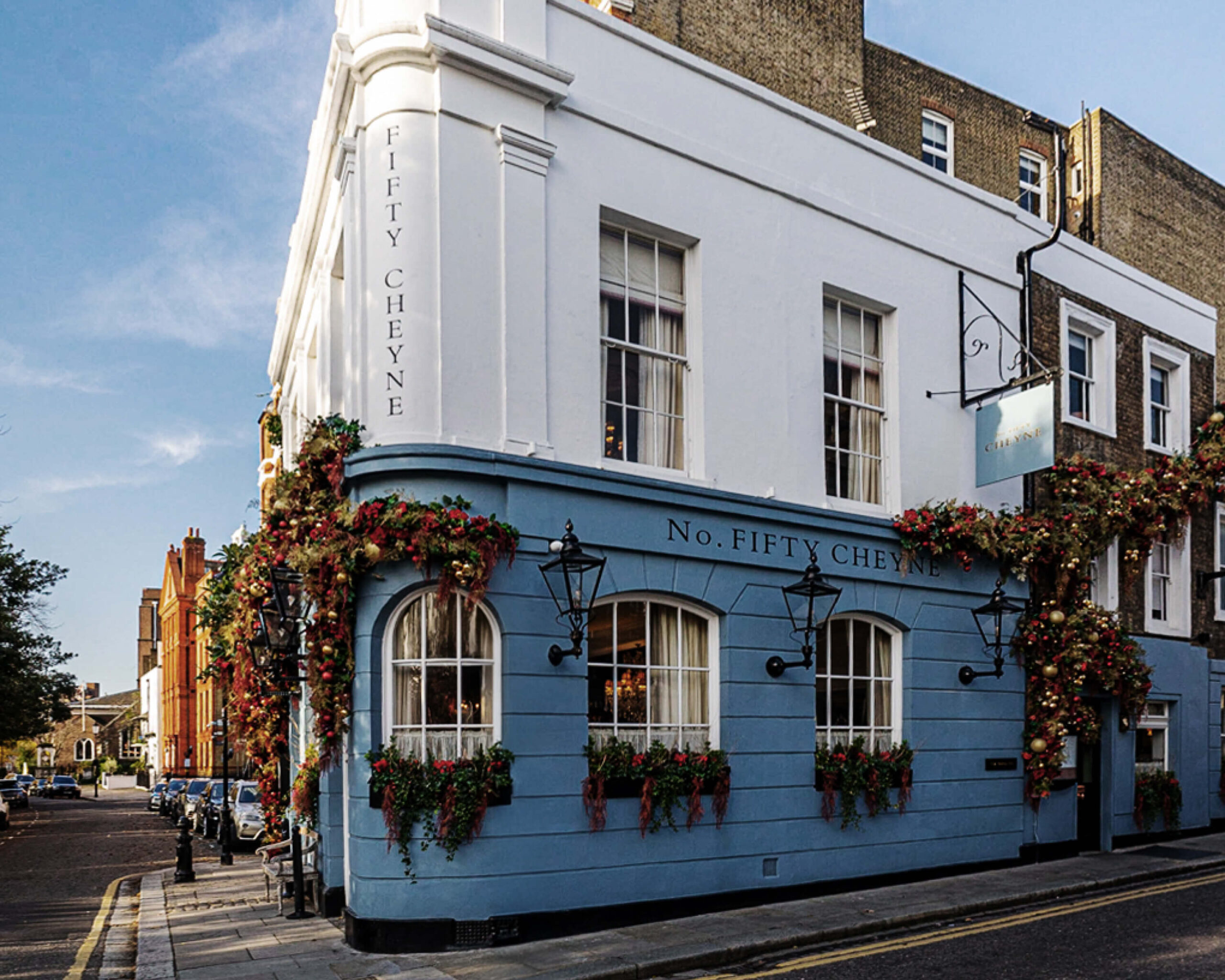 Exterior of No. 50 Cheyne in Chelsea with classic London architecture and warm lighting, setting the tone for London restaurant design.