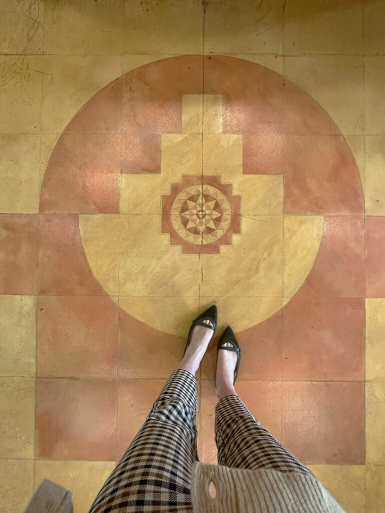 The Cosmic House London pastel floor with circular and geometric motifs in yellow and soft orange