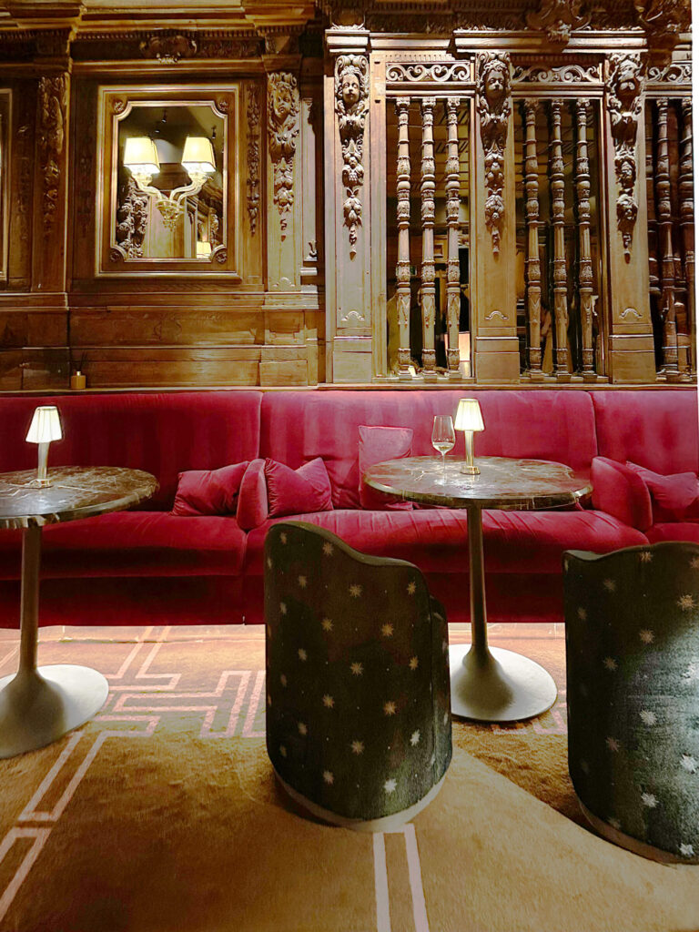 London restaurant and club design Tramp with red custom banquettes and historic woodwork, a bold look in London restaurant design.