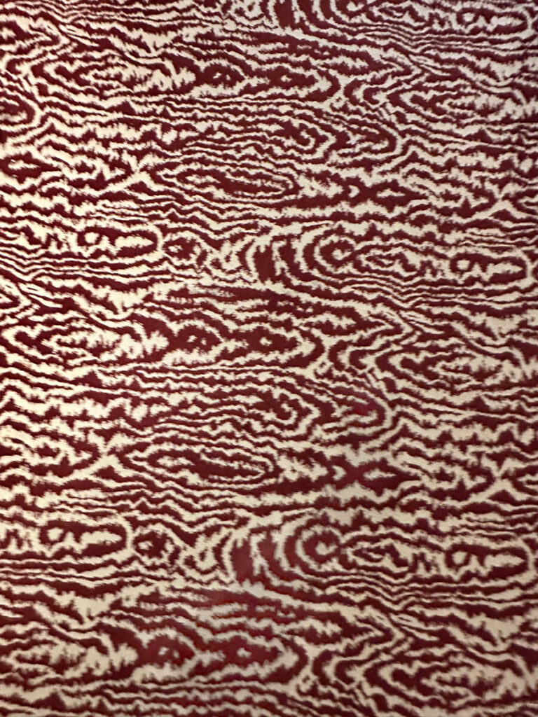 Cartier Mansion New York faux bois maroon and cream wool carpet with custom interior design detailing