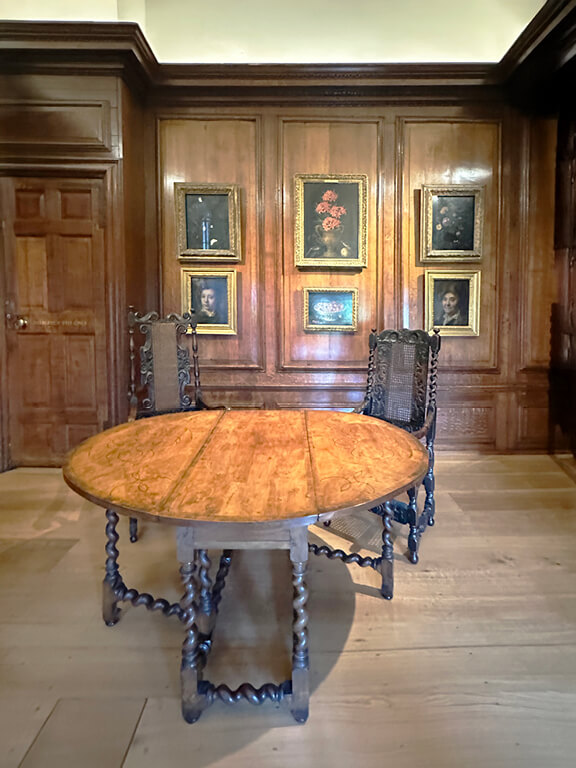 Jacobean table set against natural oak paneling and millwork in the Queen’s Quarters at Kensington Palace.