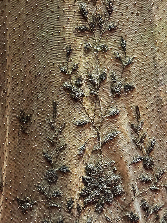 Queen Alexandra’s 1902 coronation dress shown in detail, featuring gold embroidery and delicate Edwardian craftsmanship.
