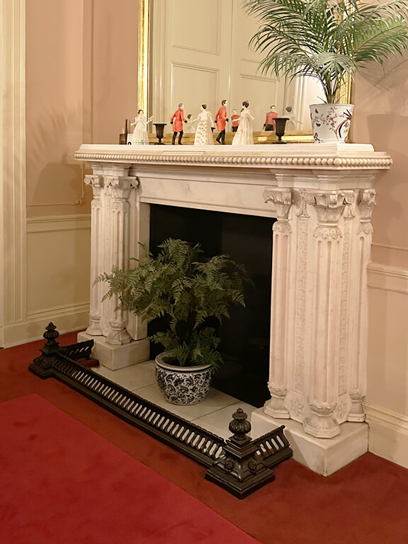 Kensington Palace Interiors featuring a white marble fireplace showcasing refined British interior design.