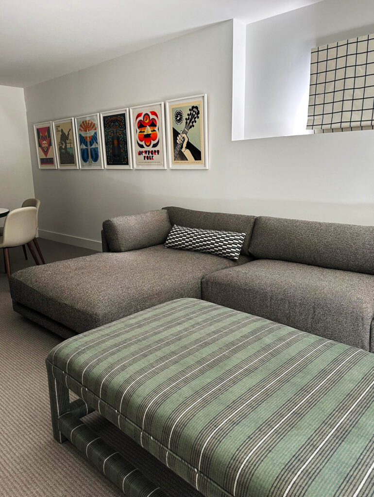 Blu Dot sectional and custom ottoman by Liven Up Design in Zak & Fox fabric, with Newport Folk Festival prints in the basement media room.