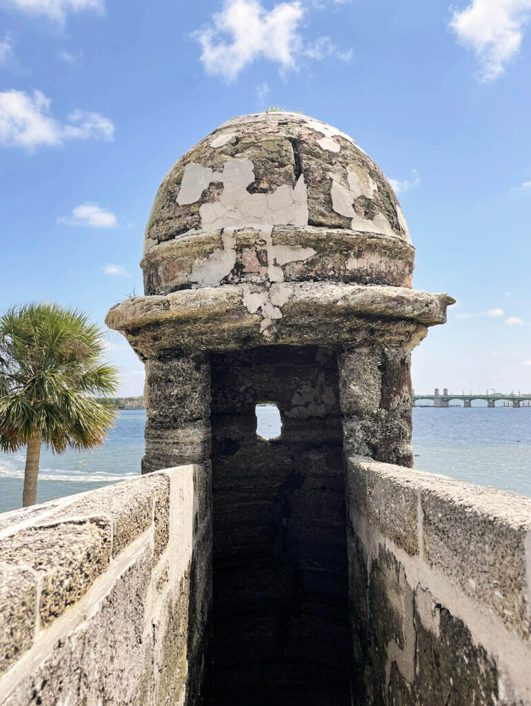 A rounded lookout structure at the fort in St. Augustine with a small viewing hole.