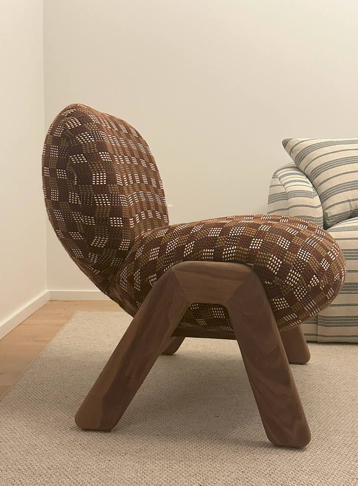 Custom armless lounge chair in Pierre Frey woven wool for the living room of a modern Upper East Side apartment, showcasing NYC interior design.