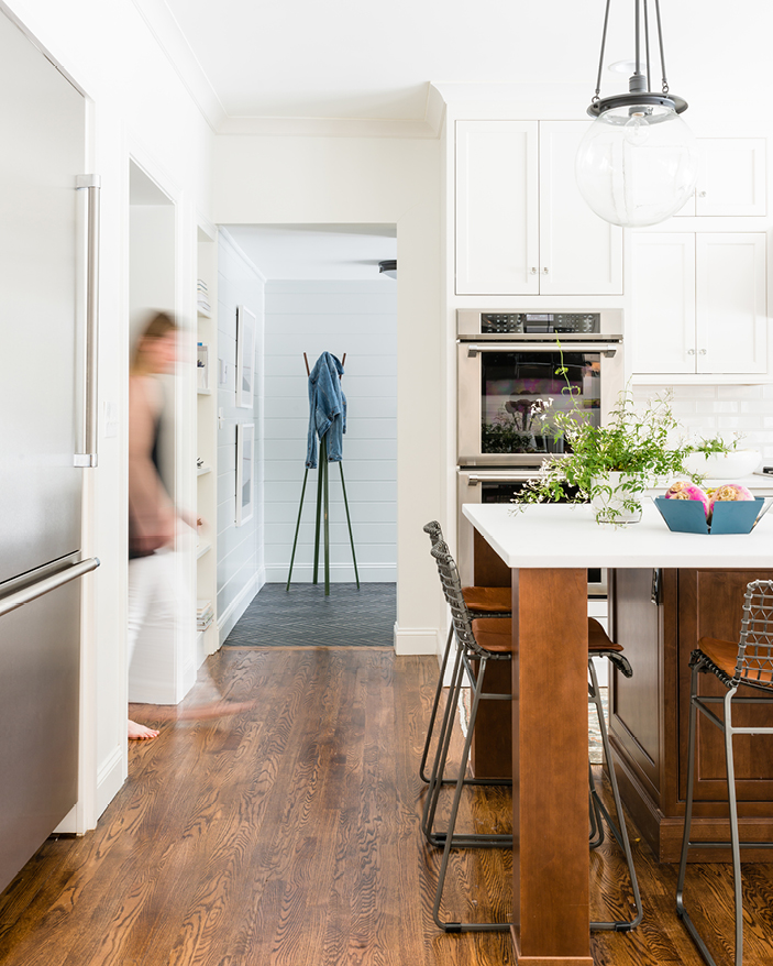 Large-scale addition and renovation in Needham featuring a bright white kitchen with a walnut island. Designed by Boston kitchen and bath designer Sarah Scales.