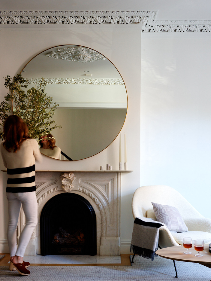 Historic brownstone featuring an original fireplace, preserved and enhanced by a New England interior designer.