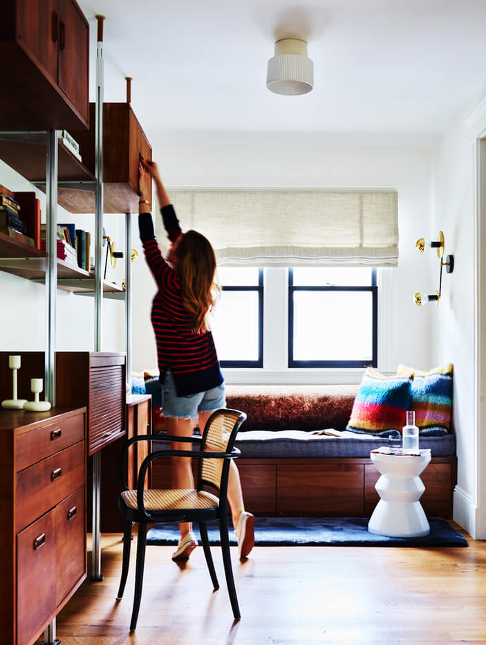 A retro desk and vintage chair in a Brookline, MA home. Design inspiration from travel and history, blending vintage furniture into home design.