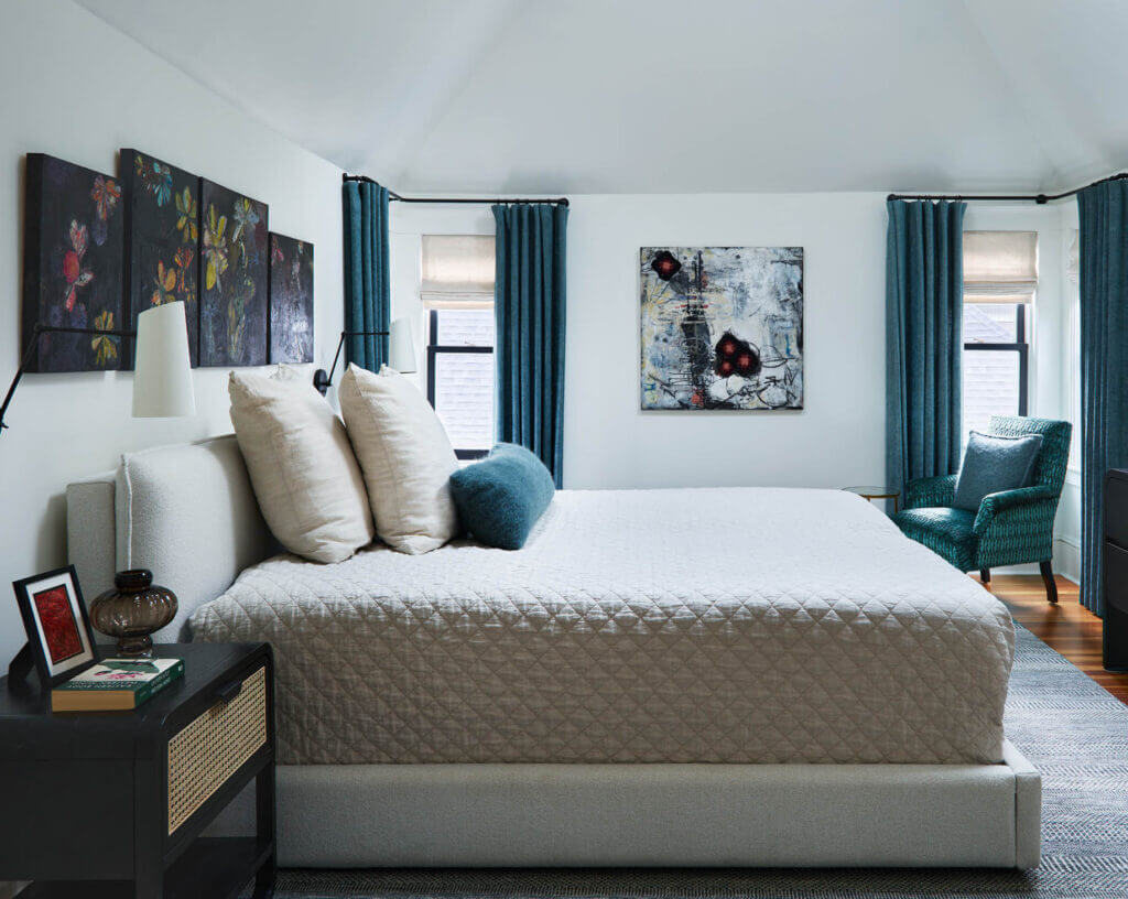 Custom interior design brings dark teal Gastón y Daniela linen drapery, a vintage chair in Pierre Frey velvet, and custom wool pillows together.