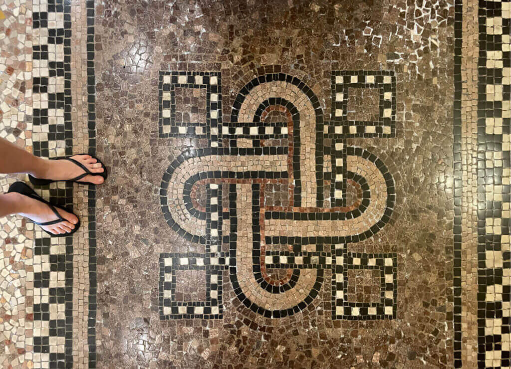 A unique historic mosaic floor at Flagler College in St. Augustine, Florida. Travel inspiration for interior design through intricate patterns.