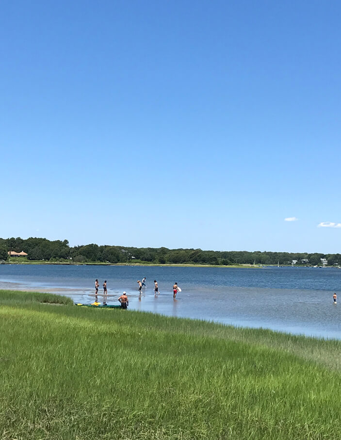 New England design inspiration from a serene beach and water view in Falmouth, Massachusetts.