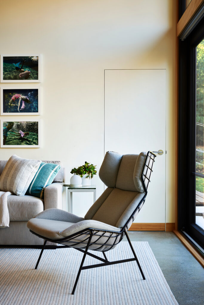 Modern living room with luxury furniture and simple interiors in a new construction home in Hingham, designed for modern living.