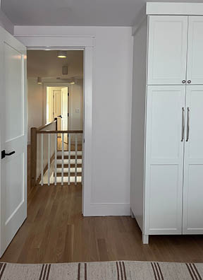 Bedroom design in a new build beach house on Boston’s South Shore, created by a Boston-area design firm in a coastal community.