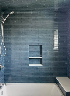 Kids bathroom with blue wall and ceiling tile in a new build beach house on Boston’s South Shore by Boston interior decorators.